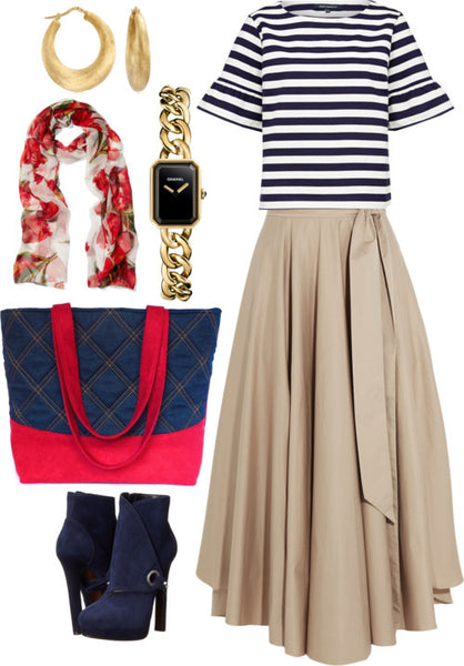 the anjelica tote bag styled with a khaki maxi skirt and black and white striped top