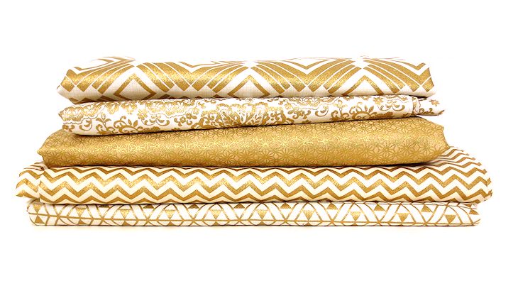stack of metallic gold fabric