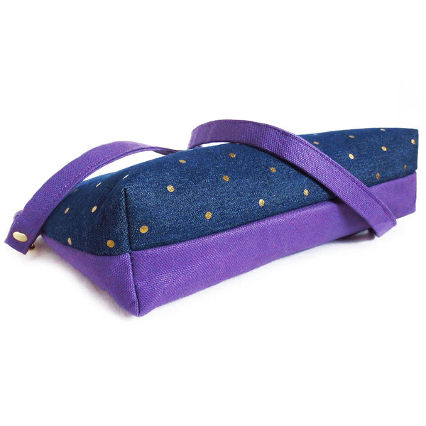 the bottom of the lola crossbody bag, showing the 2.5" gusset