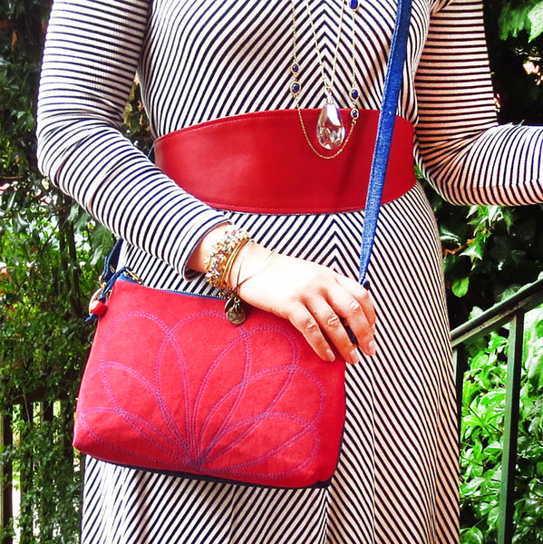 Emily wearing the persephone crossbody bag, and the aida wrap belt