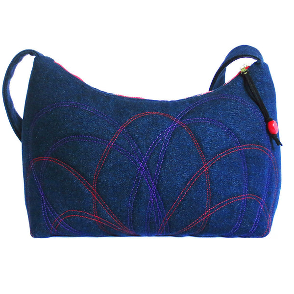the back of the persephone bag features a similar but not identical petal motif