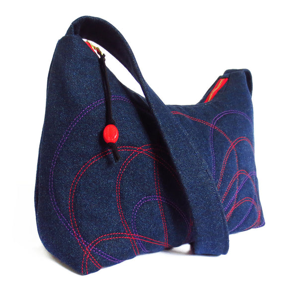 side view of the persephone handbag from Holland Cox