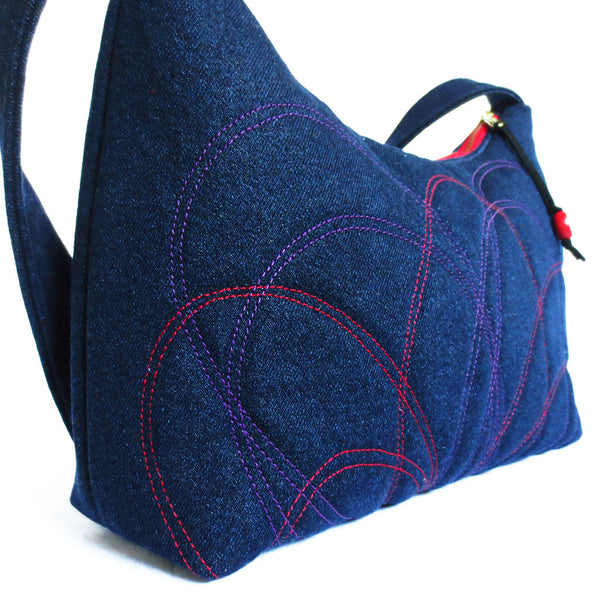 close up of the stitching on the persephone handbag